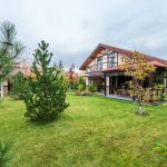 Charming suburban residence with lush greenery and a spacious yard, ideal for a tranquil lifestyle.